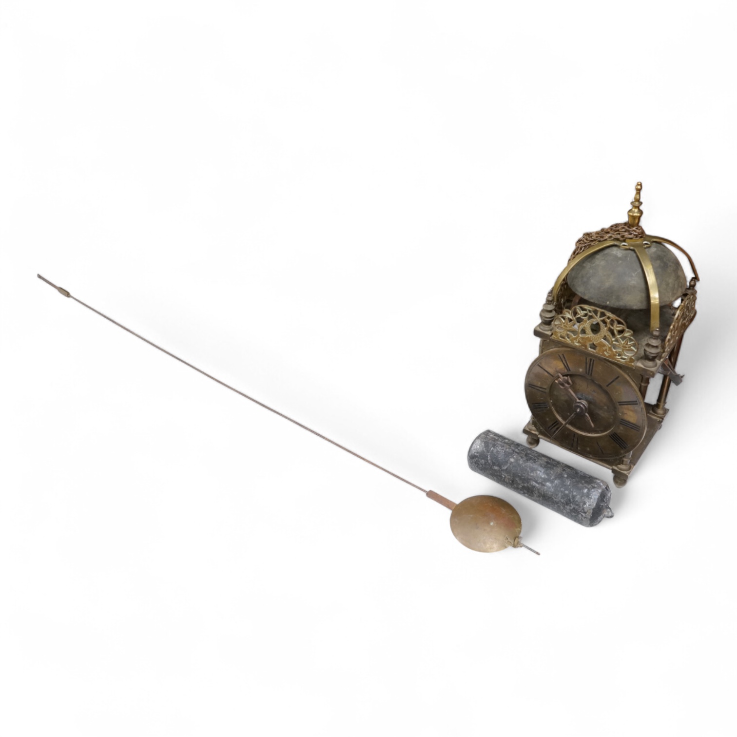 An 18th century lantern clock with pendulum and weight, the dial inscribed Philip Wardale, 37cm high